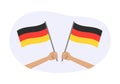 Germany waving flag icon or badge. Hand holding German flags. Vector illustration